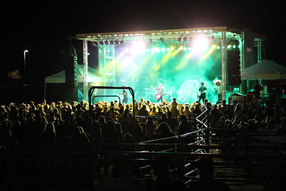 Bright lights shine our onto an audience during a concert at the Garfield County fairgrounds in Rifle, Colorado.