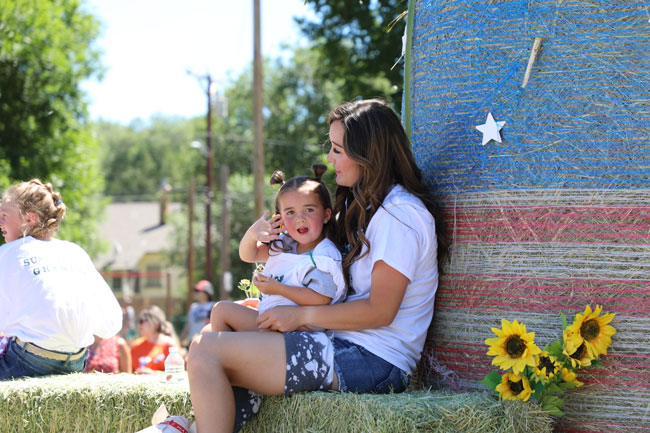 women with daughter on a float